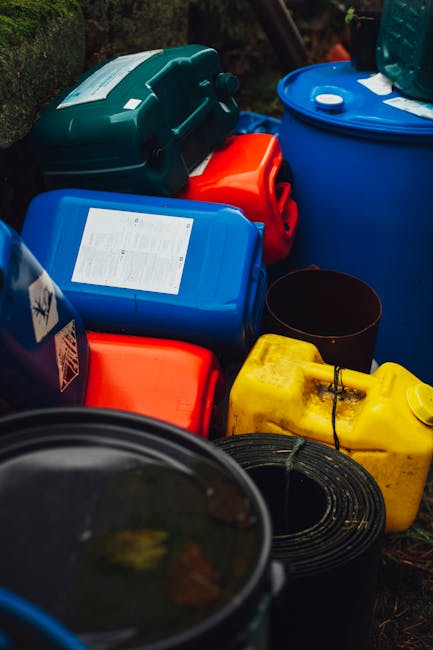 A close-up view of several empty plastic bottles, including clear and slightly dirty ones, held within a fine mesh net used for waste collection or recycling. The bottles vary in shape and size, with 